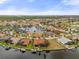 Aerial view of waterfront community features canals, homes with boat docks and nearby golf course at 3629 Licata Ct, Punta Gorda, FL 33950