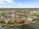 Aerial view features waterfront real estate, canal, golf course, and lovely distant views at 3629 Licata Ct, Punta Gorda, FL 33950