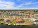 Aerial view displays waterfront houses on canal with boat docks and scenic views in distance at 3629 Licata Ct, Punta Gorda, FL 33950
