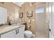 Bathroom with sleek vanity, framed mirrors, and shower with a window, offering ample natural light at 3629 Licata Ct, Punta Gorda, FL 33950