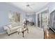 Spacious bedroom featuring a sitting area with a view, ceiling fans, and access to the pool at 3629 Licata Ct, Punta Gorda, FL 33950