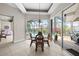 Charming dining area with pool view, stylish chandelier, and plenty of natural light at 3629 Licata Ct, Punta Gorda, FL 33950