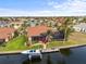 Beautiful waterfront home boasts a private dock, screened lanai, and tropical foliage at 3629 Licata Ct, Punta Gorda, FL 33950