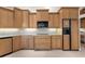 This kitchen has plenty of wooden cabinets, stainless steel appliances, granite countertops, and tile backsplash at 3629 Licata Ct, Punta Gorda, FL 33950