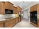 This well-appointed kitchen features custom cabinetry, granite countertops, stainless steel appliances, and tile backsplash at 3629 Licata Ct, Punta Gorda, FL 33950