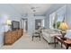 Cozy living room with soft blue walls, comfortable seating, and a view to another room at 3629 Licata Ct, Punta Gorda, FL 33950