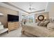 Comfortable main bedroom with king bed, ceiling fan, and water view at 3629 Licata Ct, Punta Gorda, FL 33950