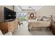 Comfortable main bedroom with king bed, ceiling fan, and water view at 3629 Licata Ct, Punta Gorda, FL 33950