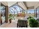 A screened-in lanai features a pool, spa, waterfront views, and comfortable seating, creating a relaxing outdoor oasis at 3629 Licata Ct, Punta Gorda, FL 33950