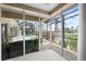 The sunroom offers beautiful views of a screened-in lanai with a pool, spa, and waterfront, bringing the outdoors in at 3629 Licata Ct, Punta Gorda, FL 33950
