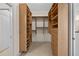 Large walk-in closet with custom wooden shelving and drawers at 3629 Licata Ct, Punta Gorda, FL 33950