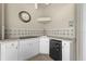 Outdoor wet bar featuring sink, counter, storage and beverage cooler at 3629 Licata Ct, Punta Gorda, FL 33950