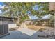 Spacious backyard featuring patio, mature landscaping, and privacy fence at 3702 Pensdale Dr, New Port Richey, FL 34652