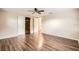 Relaxing bedroom with wood floors, neutral walls, and closet at 3702 Pensdale Dr, New Port Richey, FL 34652