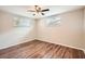 Charming bedroom with wood floors, neutral walls, and natural light at 3702 Pensdale Dr, New Port Richey, FL 34652