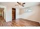 Inviting bedroom with wood floors and neutral walls and closet at 3702 Pensdale Dr, New Port Richey, FL 34652