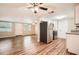 Open-concept kitchen with new stainless-steel appliances and wood-look floors at 3702 Pensdale Dr, New Port Richey, FL 34652