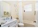 Bright bathroom with a tub/shower, white vanity, framed mirror, and décor at 4174 70Th Street E Cir, Palmetto, FL 34221