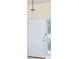 A close-up of the bright white front door, complete with modern hardware at 4174 70Th Street E Cir, Palmetto, FL 34221