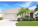 Charming single-story home with a well-maintained lawn, mature landscaping, and a two-car garage at 4174 70Th Street E Cir, Palmetto, FL 34221
