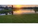 Serene lake at sunset reflecting warm colors, enhancing the natural beauty and tranquility of the surroundings at 4174 70Th Street E Cir, Palmetto, FL 34221
