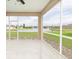 Enclosed lanai overlooking a picturesque lake with fountain, offering serene views and outdoor living at 4174 70Th Street E Cir, Palmetto, FL 34221