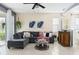 Cozy living room with a comfortable sectional sofa, stylish decor, and plenty of natural light at 4174 70Th Street E Cir, Palmetto, FL 34221
