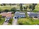 Aerial view of a single-Gathering home with well-maintained landscaping and a large backyard on a golf course at 23 Golfview Rd, Rotonda West, FL 33947