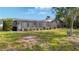 Spacious backyard featuring a screened-in lanai, perfect for outdoor entertaining at 23 Golfview Rd, Rotonda West, FL 33947