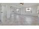 Spacious bedroom with neutral tile flooring, mirrored closet, and bright natural light at 23 Golfview Rd, Rotonda West, FL 33947