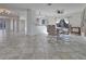 Open-concept dining room with modern table set, tiled floor and lots of natural light at 23 Golfview Rd, Rotonda West, FL 33947
