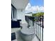 Relaxing balcony area featuring contemporary outdoor seating and a view of neighborhood street at 3211 W Swann Ave # 408, Tampa, FL 33609