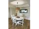 Charming dining room with a round table, modern lighting fixture, and stylish décor at 3211 W Swann Ave # 408, Tampa, FL 33609