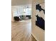 Living room featuring wood floors, neutral decor, stylish furnishings, and a light and airy ambiance at 3211 W Swann Ave # 408, Tampa, FL 33609