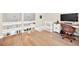 Second story bedroom with hardwood floors, a desk, and a view overlooking the first floor at 1111 N Bayshore Blvd # D6, Clearwater, FL 33759