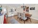 An open dining area is complemented with a spiral staircase, wood floors, and a decorative chandelier at 1111 N Bayshore Blvd # D6, Clearwater, FL 33759