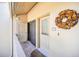 Condo front door with decorative wreath and adjacent storage, adding charm and convenience to the unit at 1111 N Bayshore Blvd # D6, Clearwater, FL 33759