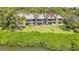 Waterfront condos featuring patios, palm trees, and lush grass for relaxation and tropical living at 1111 N Bayshore Blvd # D6, Clearwater, FL 33759
