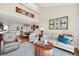 Open-concept living room showcasing water views, neutral furniture, dining area and spiral staircase at 1111 N Bayshore Blvd # D6, Clearwater, FL 33759