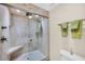 Shower room featuring a glass door and ceramic tile at 1111 N Bayshore Blvd # D6, Clearwater, FL 33759