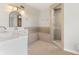 Spa-like bathroom with tiled walk-in shower, built-in bench, and stylish fixtures, perfect for relaxation at 3400 Dawson Ln, Punta Gorda, FL 33950