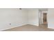 Neutral bedroom with tile flooring and doorway leading to the Primary bath at 3400 Dawson Ln, Punta Gorda, FL 33950