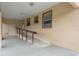 Covered entrance with a ramp and three windows on a well-maintained home at 3400 Dawson Ln, Punta Gorda, FL 33950