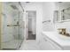 Bathroom featuring shower with glass doors, and vanity with modern fixtures, plus a towel bar at 520 Baywood S Dr, Dunedin, FL 34698