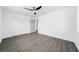 Spacious bedroom with neutral paint, closet, and a modern ceiling fan at 520 Baywood S Dr, Dunedin, FL 34698