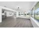 Open-concept living room with neutral tones and modern finishes at 520 Baywood S Dr, Dunedin, FL 34698