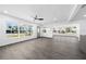 Bright living room with hardwood floors and lots of natural light at 520 Baywood S Dr, Dunedin, FL 34698