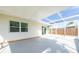Covered, screened patio provides ample space for lounging or dining al fresco via sliding glass door at 520 Baywood S Dr, Dunedin, FL 34698
