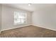 Neutral bedroom featuring plush carpet and a window with natural light at 13516 Copper Head Dr, Riverview, FL 33569