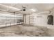 Spacious two-car garage with clean floors and ample storage shelving at 13516 Copper Head Dr, Riverview, FL 33569